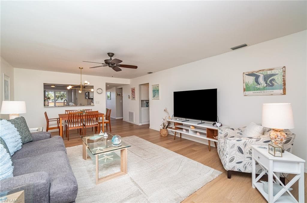 Open living room and dining area with LVP flooring