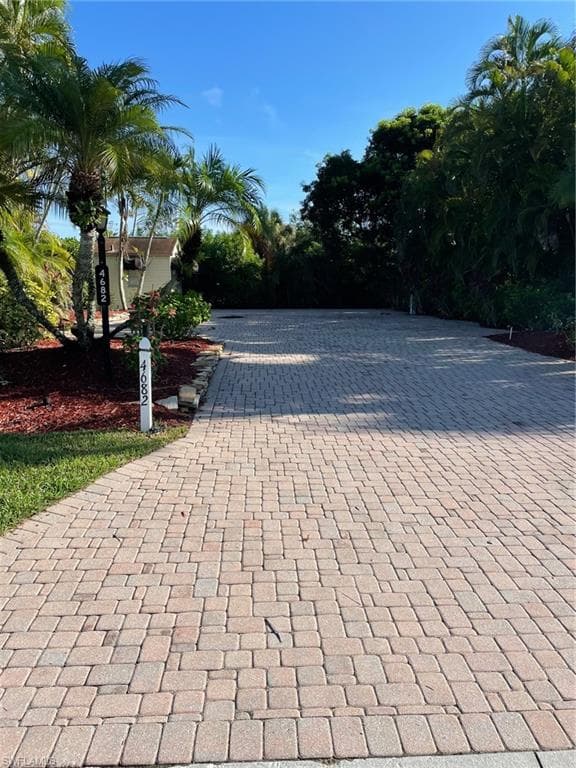 Surrounding community with decorative driveway