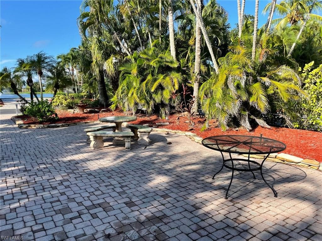Surrounding community with a patio area