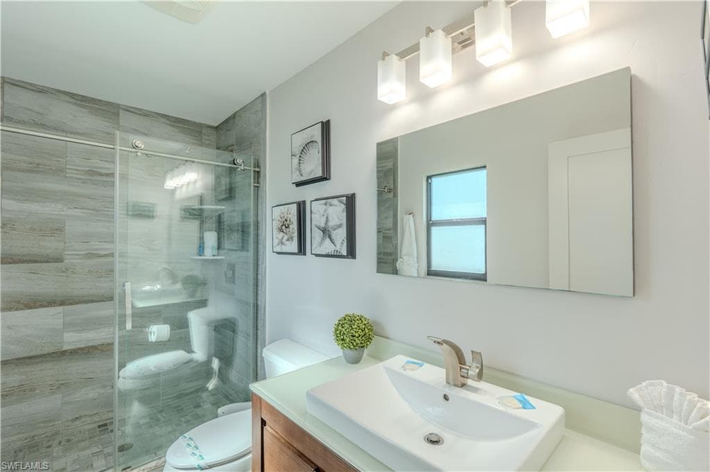 Bathroom featuring vanity and a stall shower - Virtually Edited Image