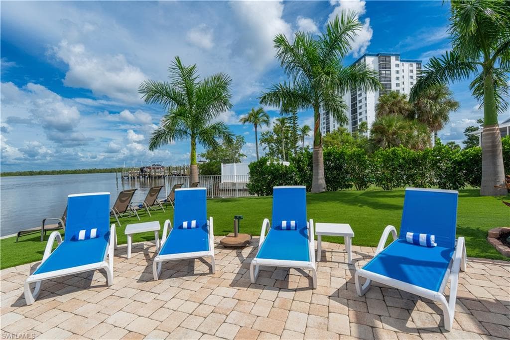 View of patio / terrace with a water view - Virtually Edited Image