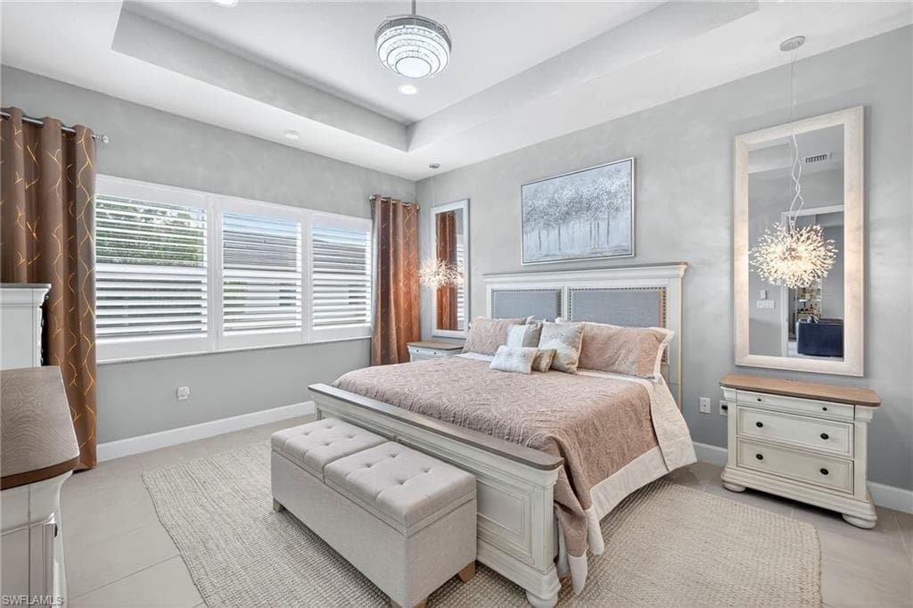 Plenty of room for a king sized bed and large dresser, plus a chair! Lighting above night stands convey!
