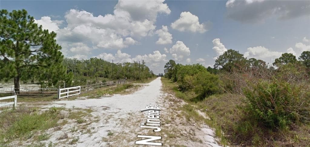 View of dirt / gravel road featuring a view of countryside