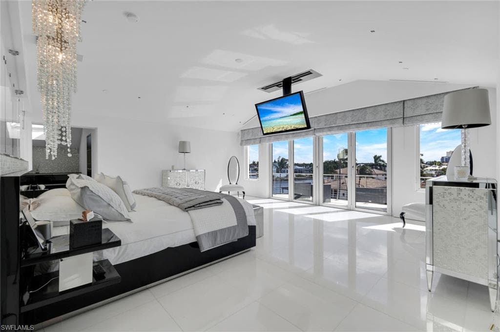 Fourth-floor master bedroom with Thassos marble floors, custom lighting, and stunning views.
