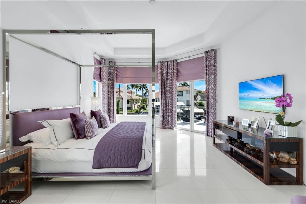 Thassos white marble floors create a bright, elegant, and timeless luxury bedroom