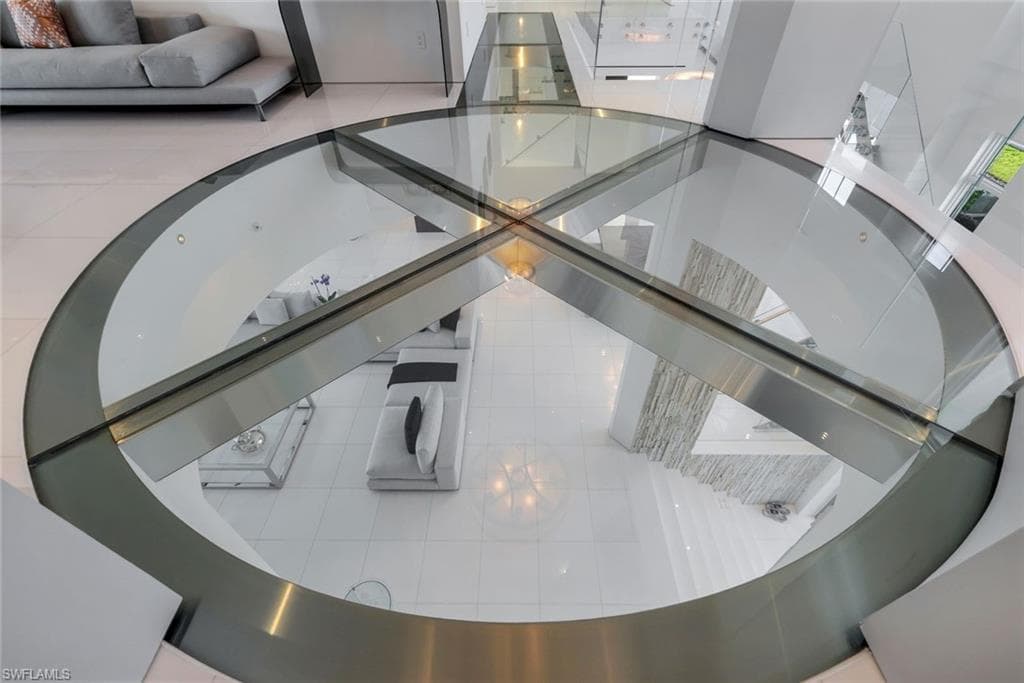 Custom glass and stainless-steel floor with precision engineering and contemporary architectural design.
