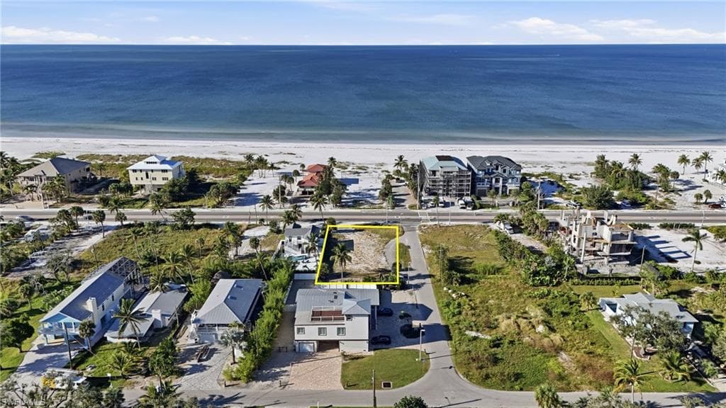 View of property location featuring waterfront with a beach - Virtually Edited Image
