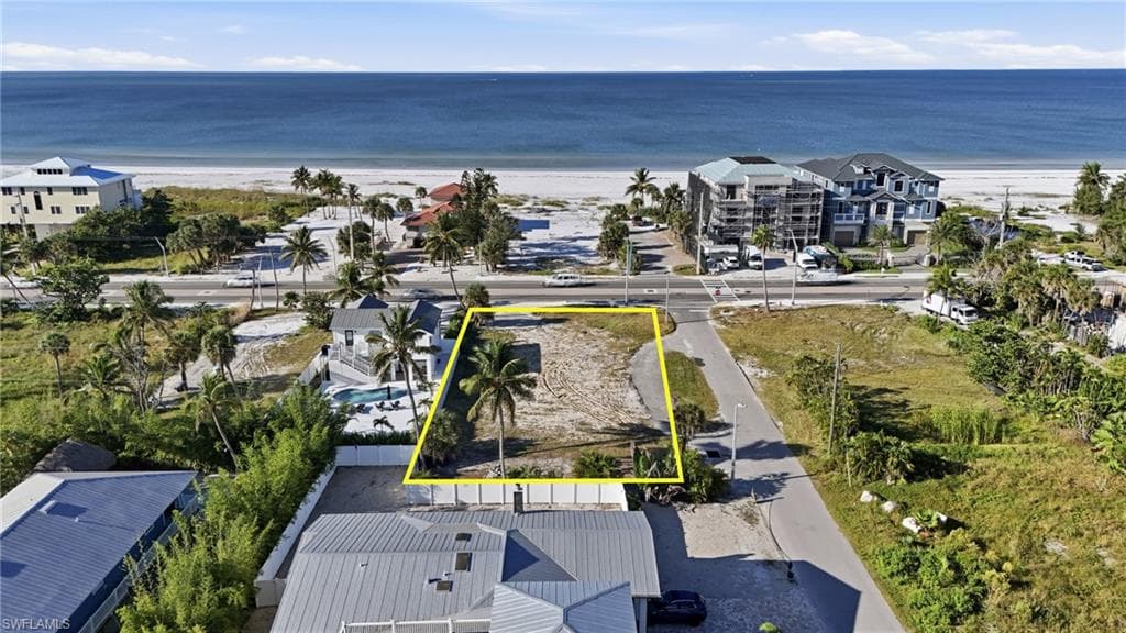 Aerial view of property and surrounding area featuring property boundaries highlighted - Virtually Edited Image