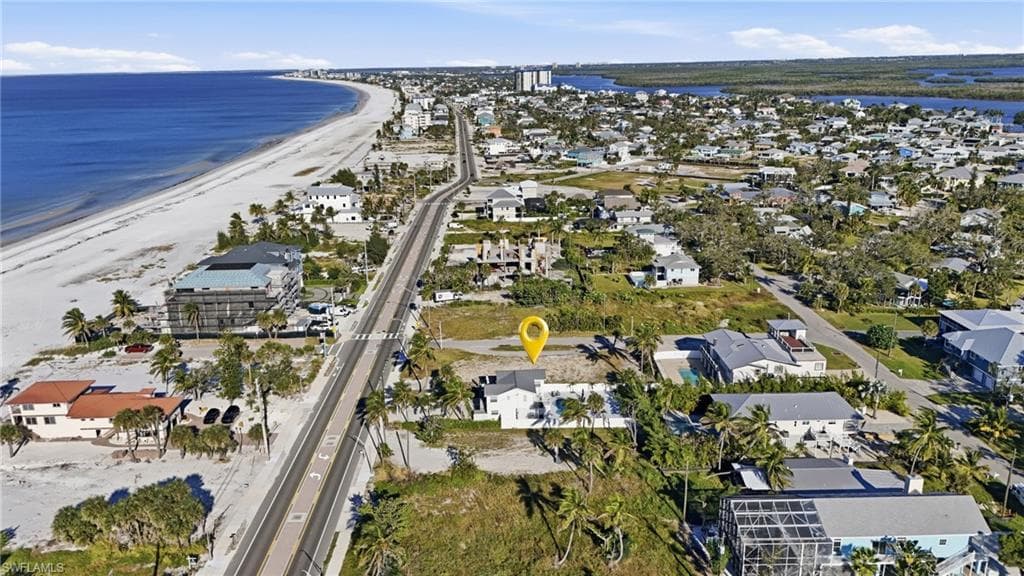 Aerial view of property and surrounding area featuring nearby suburban area - Virtually Edited Image