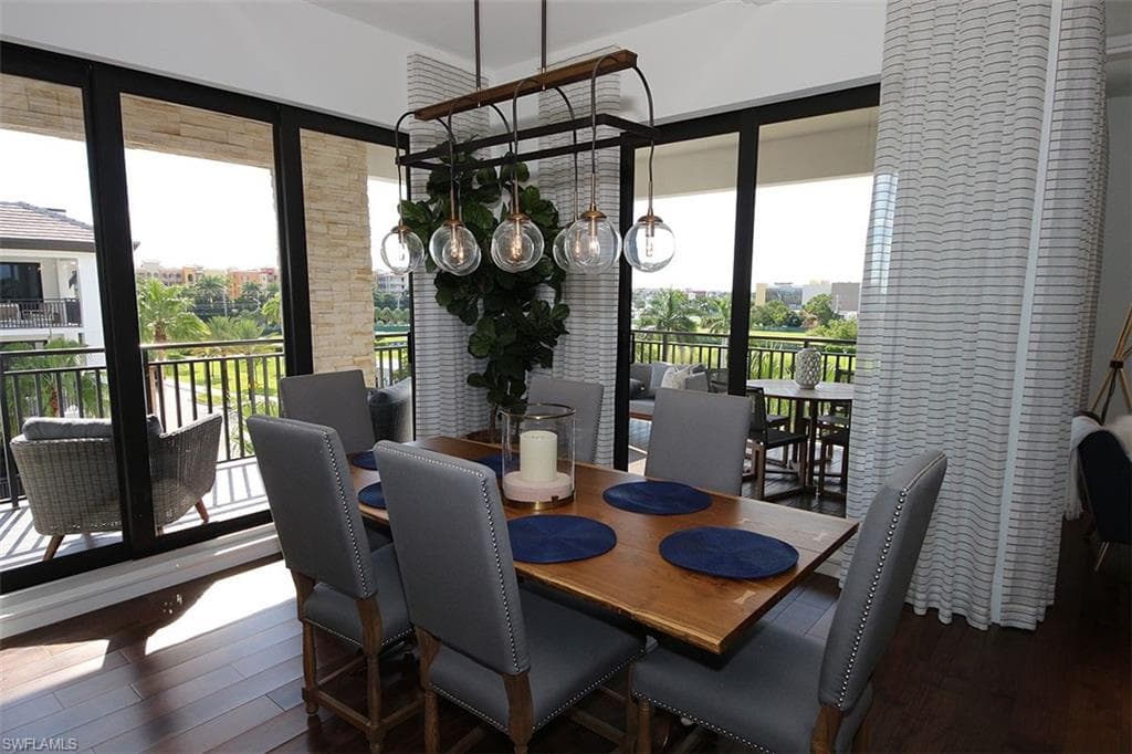 Dining space with dark wood-style flooring