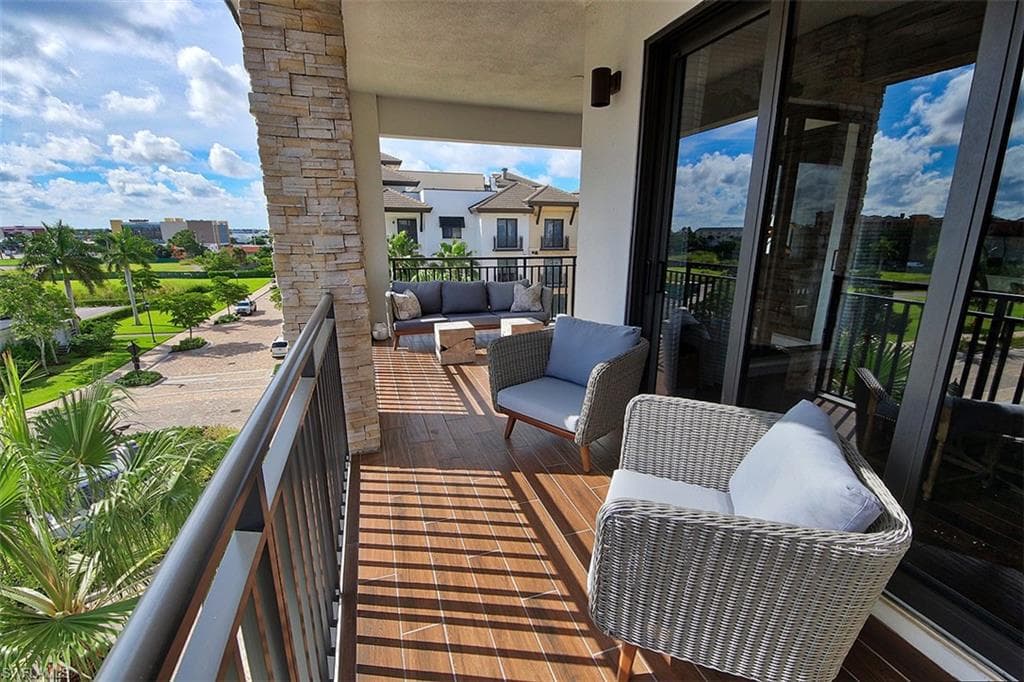 Balcony featuring a sunroom