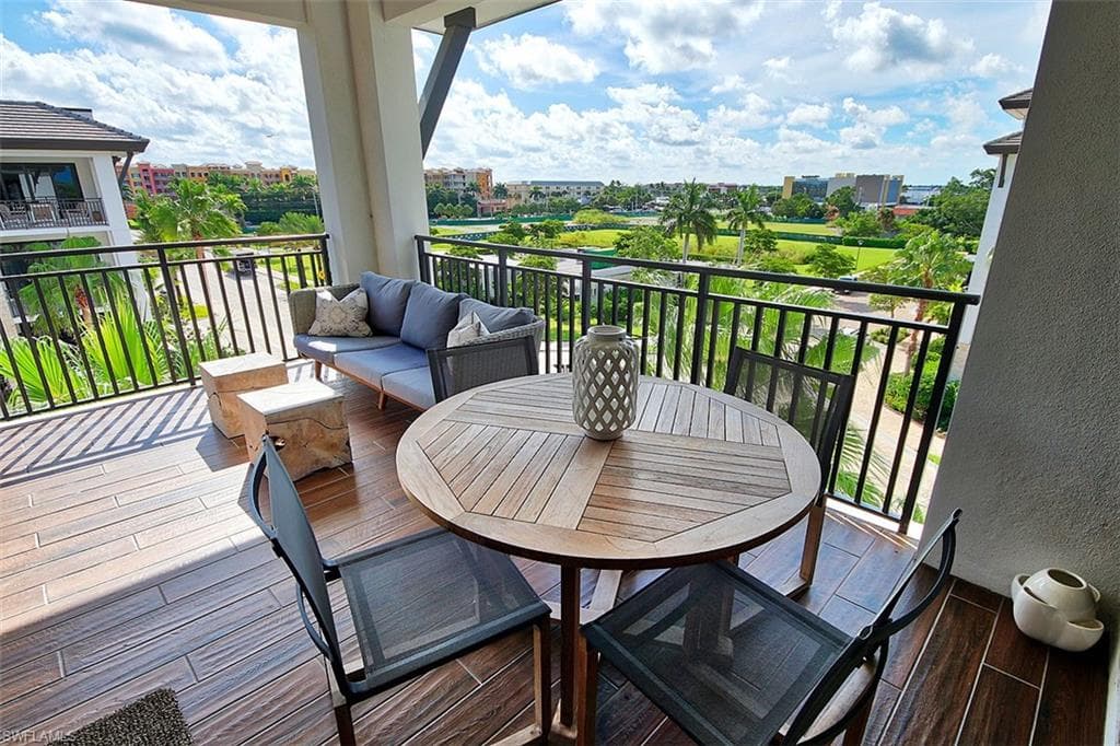 Balcony with an outdoor hangout area and outdoor dining space
