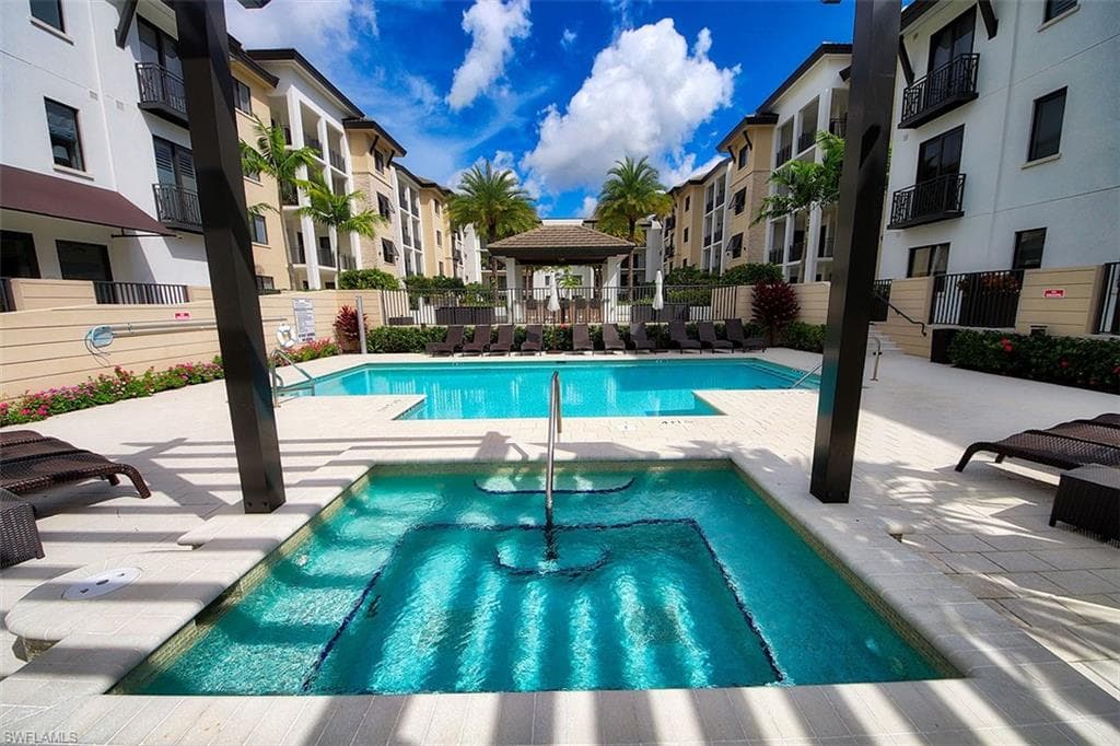 Community pool with a gazebo and a patio area