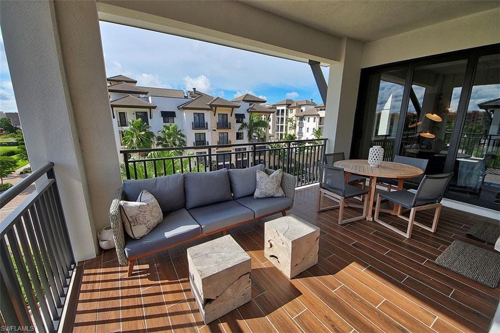 Balcony with outdoor lounge area and outdoor dining area