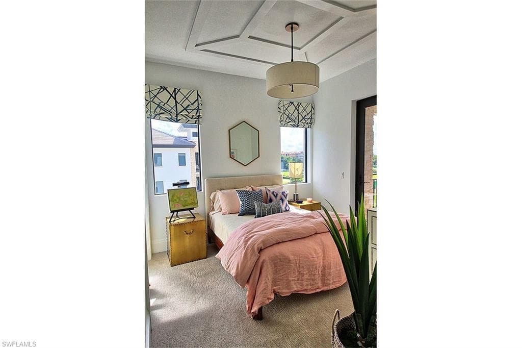 Bedroom featuring carpet floors and access to outside