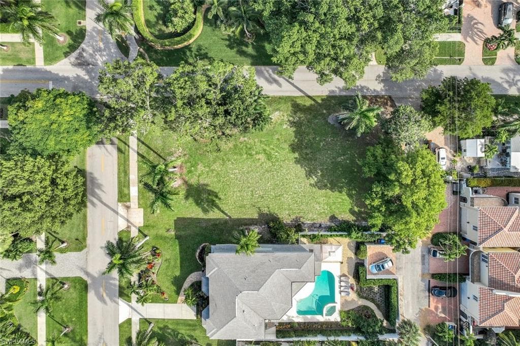 Aerial overview of property's location featuring a pool