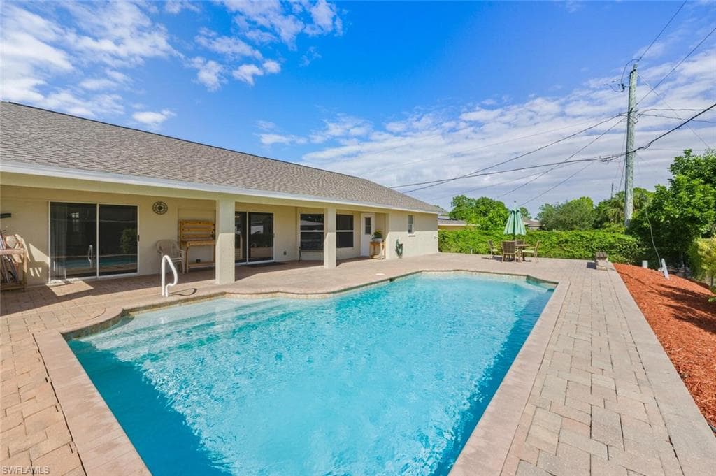 Outdoor pool with a patio area