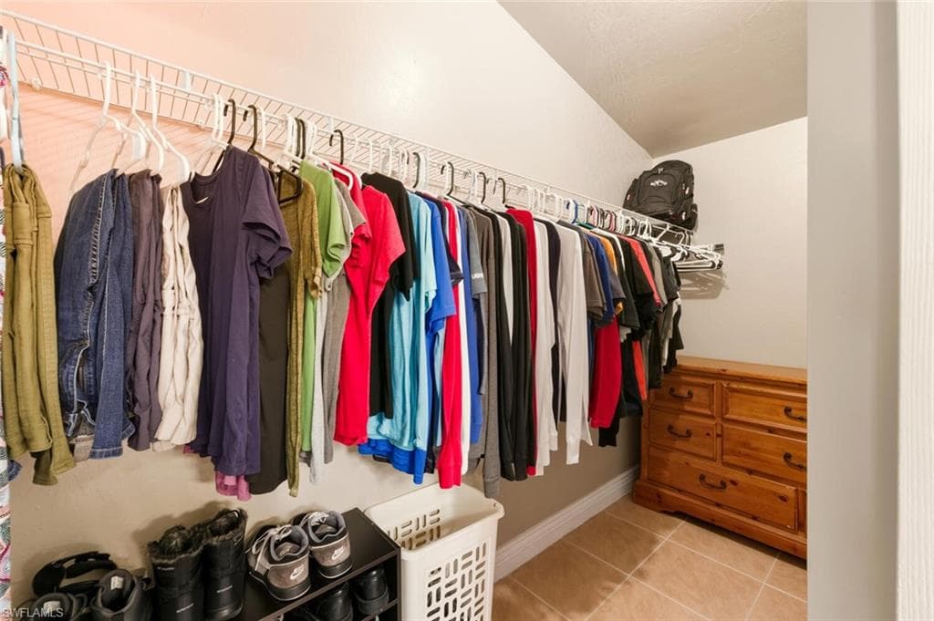 Spacious closet featuring light tile patterned floors