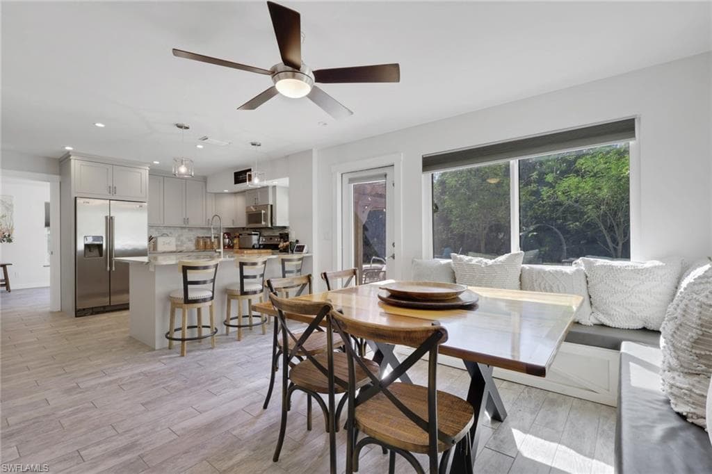 Kitchen and spacious dining area with access to the garage and outdoor space