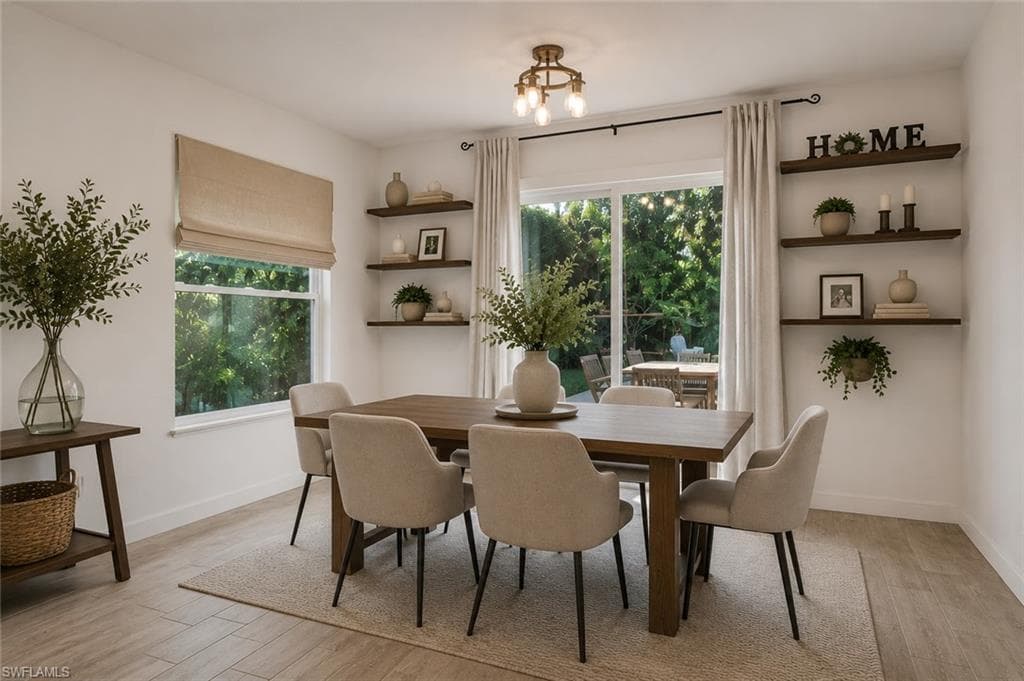 Virtually staged dining area with access to the patio pool area - ideal for entertaining!