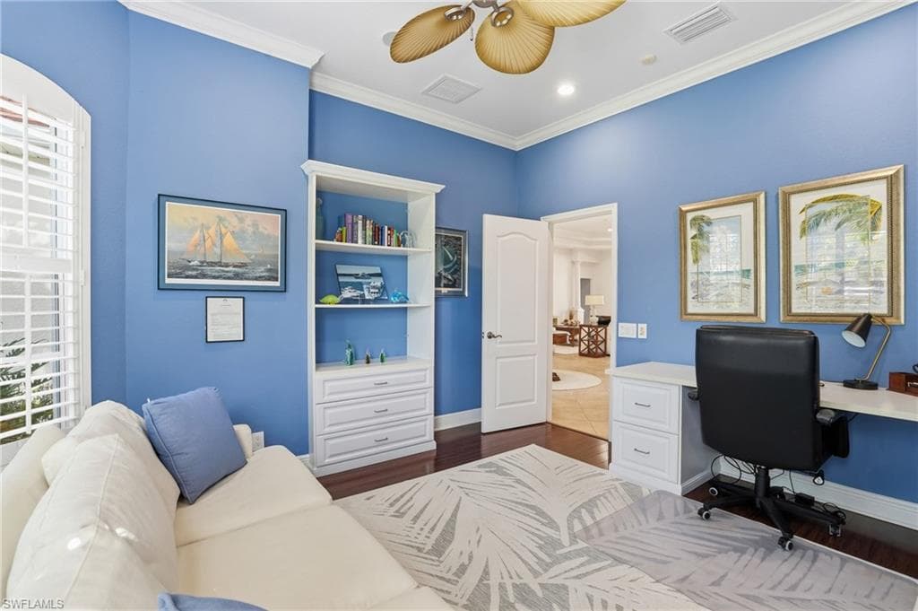 Office space featuring dark wood finished floors, crown molding, ceiling fan, and recessed lighting