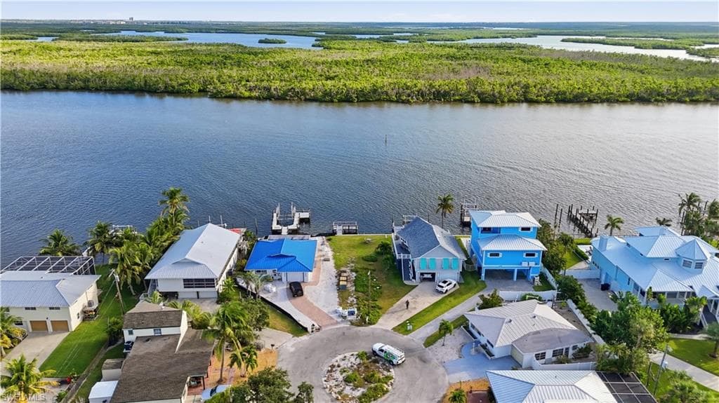 Aerial view of residential area featuring a large body of water - Virtually Edited Image