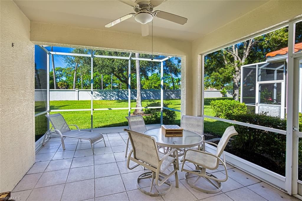 Sunroom / solarium featuring ceiling fan and outdoor dining area
