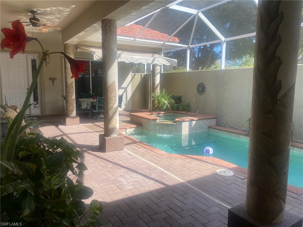 Courtyard Pool Spa and patio under screened lanai