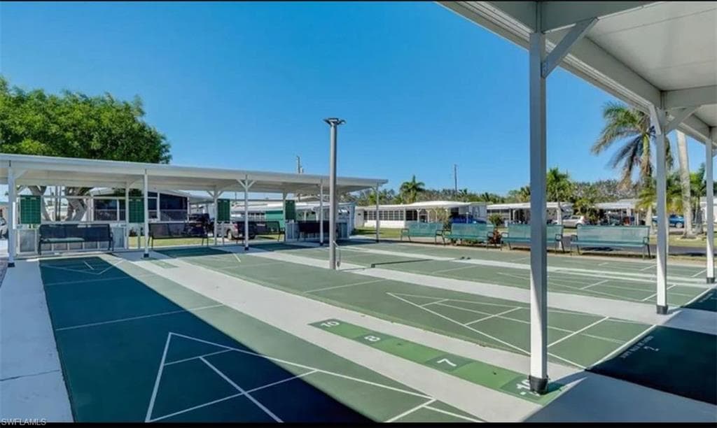 View of home's community with shuffleboard