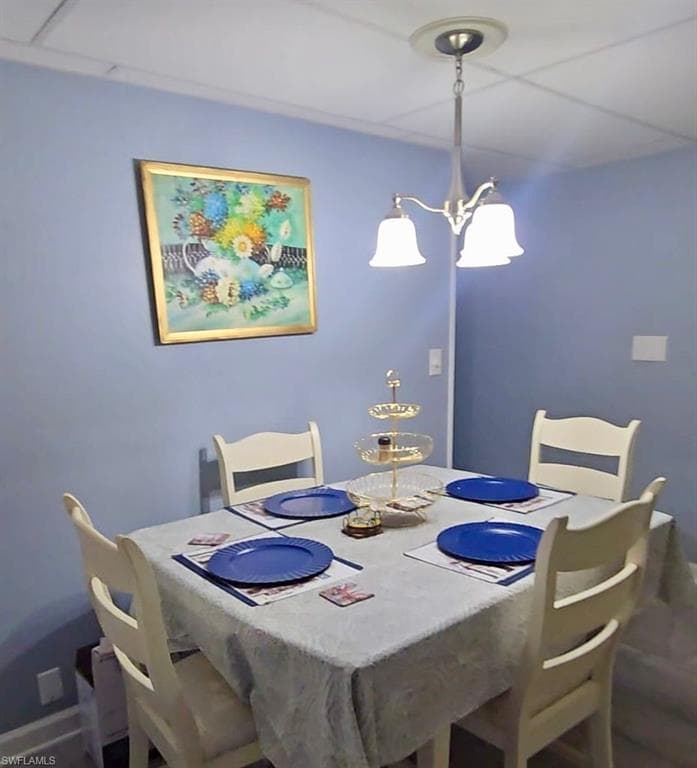 Dining area with a chandelier