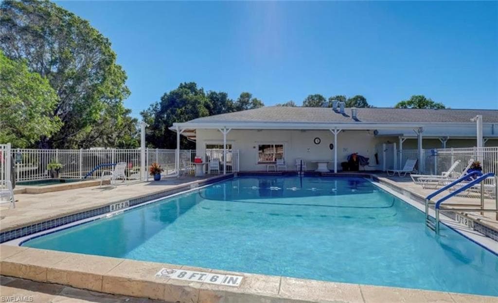 Community pool with a patio area