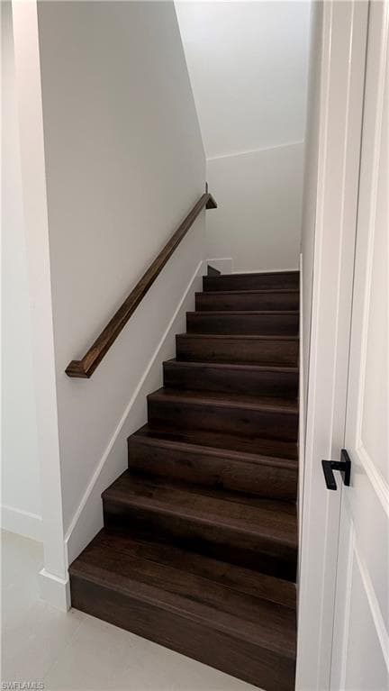 Stairs featuring tile patterned floors