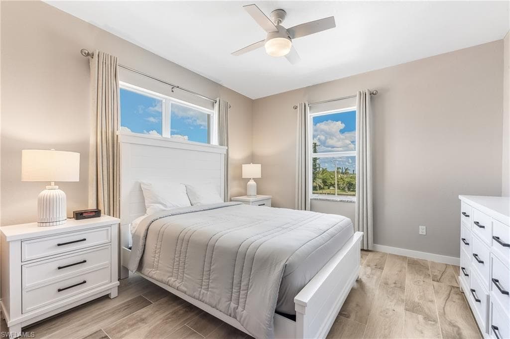 Bedroom featuring light wood-style floors and ceiling fan