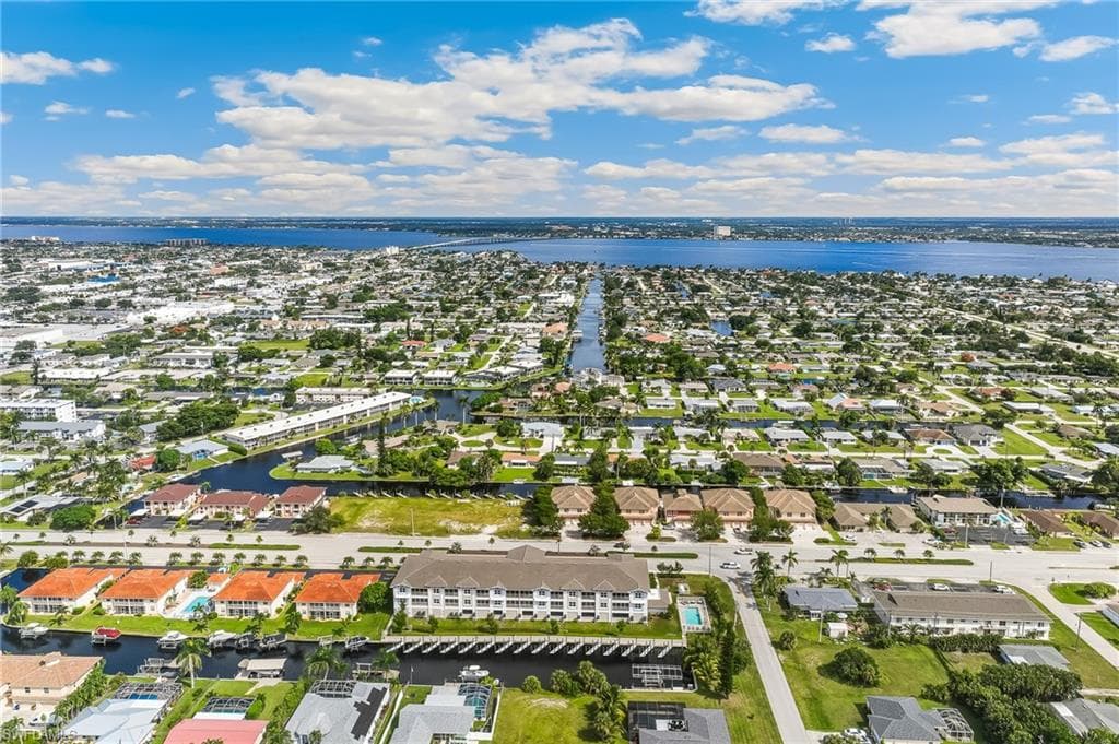 Aerial perspective of suburban area with a nearby body of water