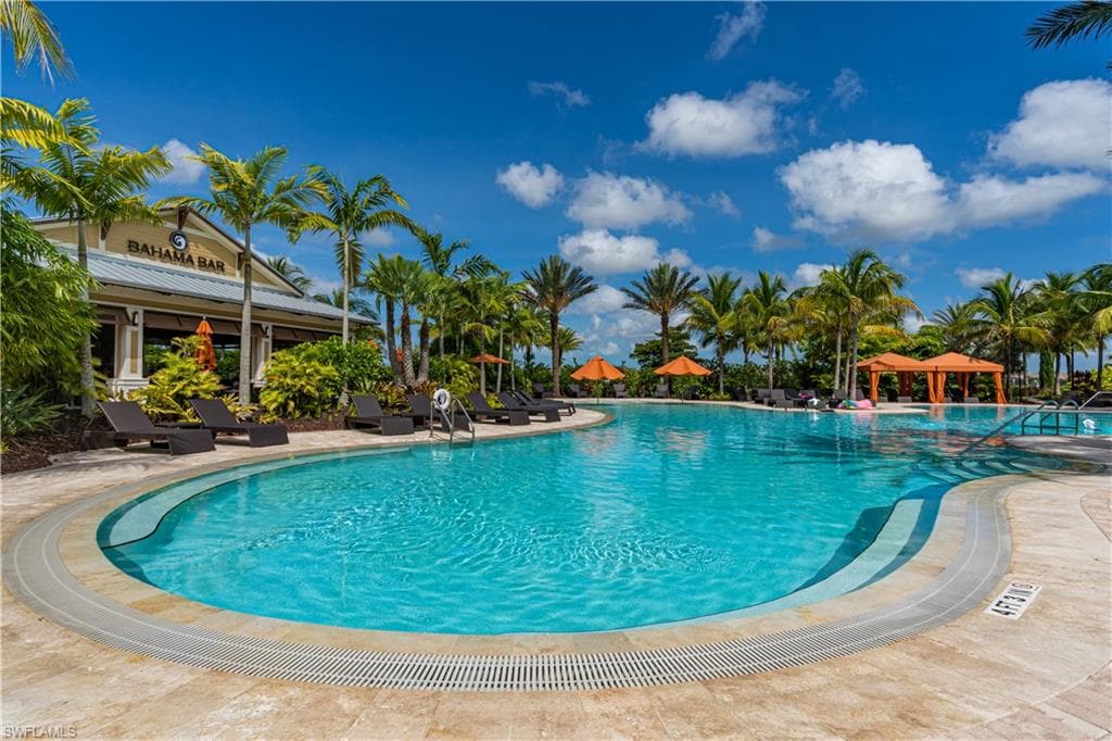 Community pool featuring a patio area and a gazebo