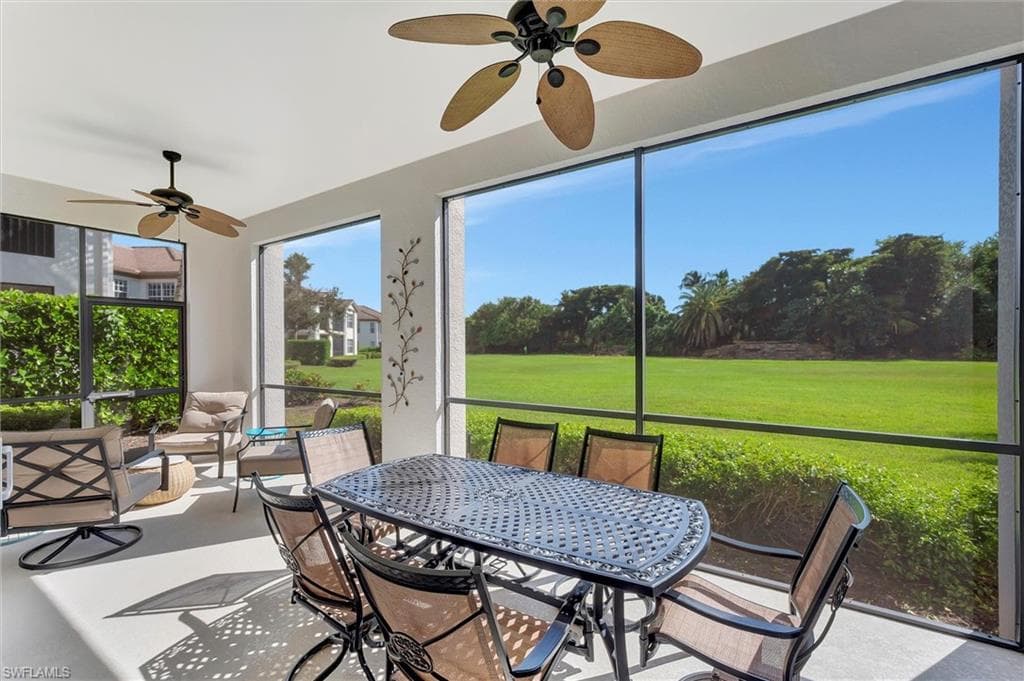 Sunroom featuring ceiling fan and outdoor dining area