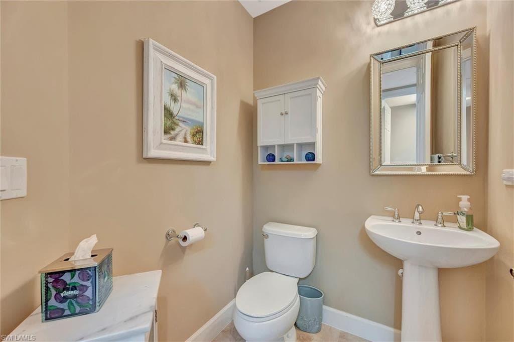 Bathroom with baseboards and toilet