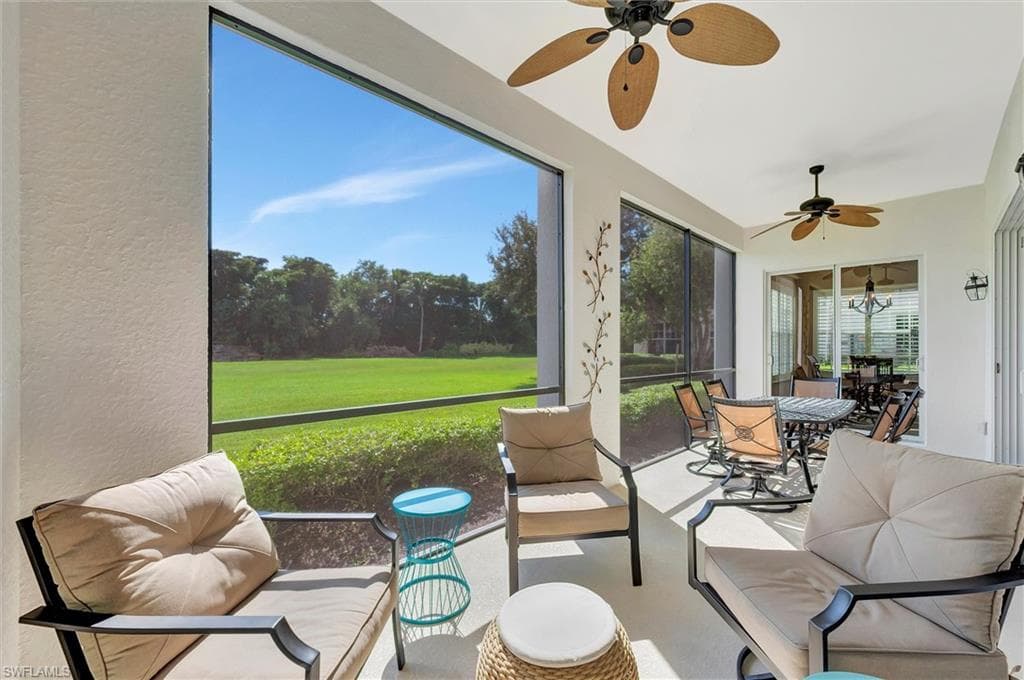Sunroom with ceiling fan and outdoor dining space