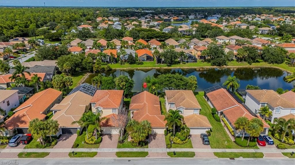 Aerial perspective of suburban area with a large body of water