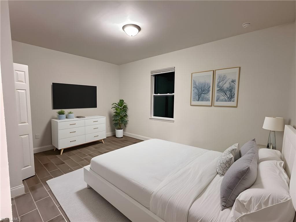 Bedroom featuring baseboards