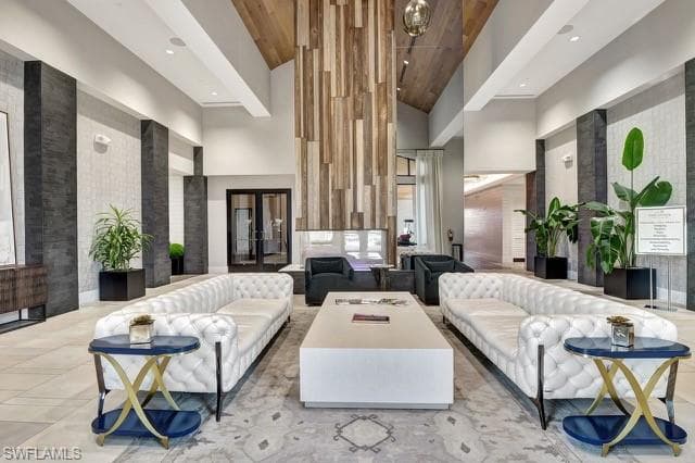 Community lobby featuring high vaulted ceiling, wood ceiling, and recessed lighting