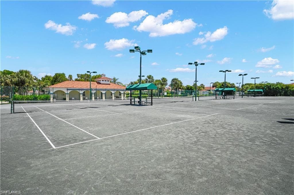 View of tennis court with community basketball court