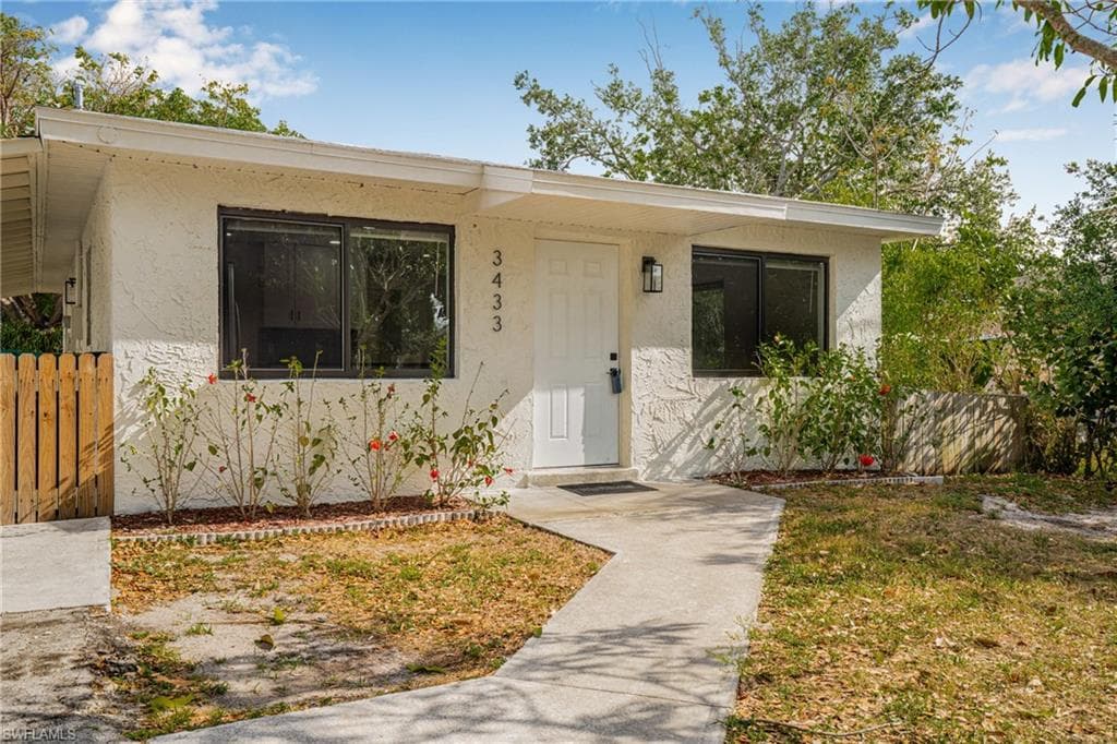 View of front of home with stucco siding