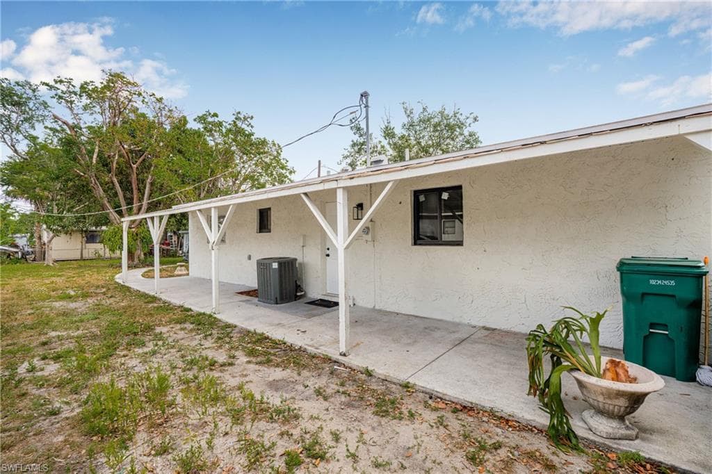 Back of house featuring stucco siding and a patio area