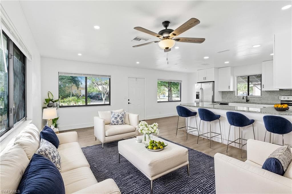 Living area featuring recessed lighting, light wood-type flooring, and ceiling fan