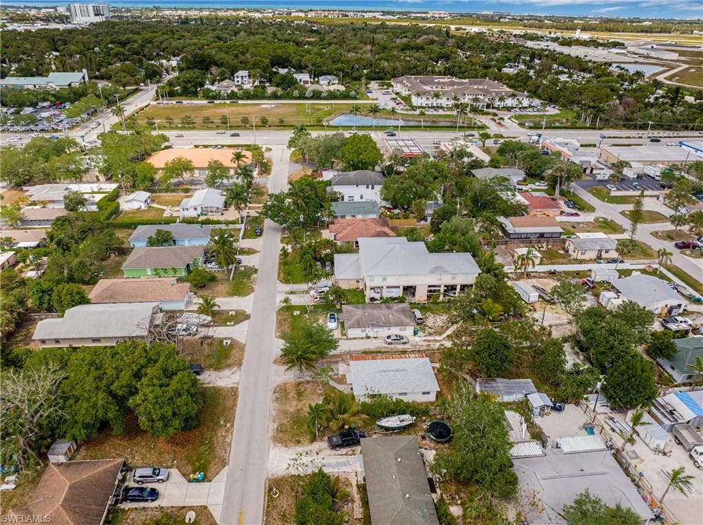 Aerial overview of property's location featuring nearby suburban area