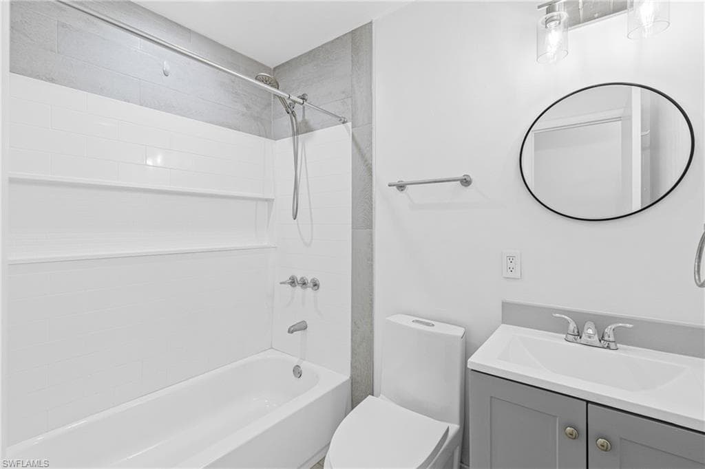 Bathroom featuring shower / bathtub combination and vanity