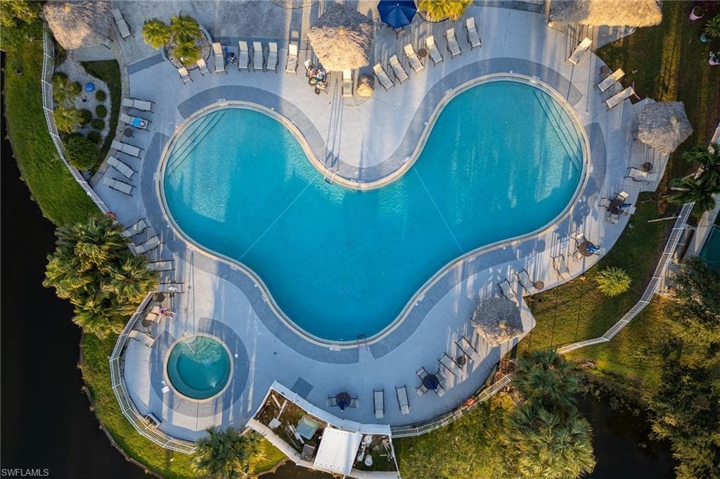 Aerial overview of property's location featuring a pool area