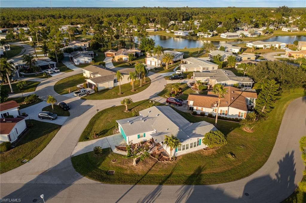Aerial overview of property's location featuring nearby suburban area and a large body of water