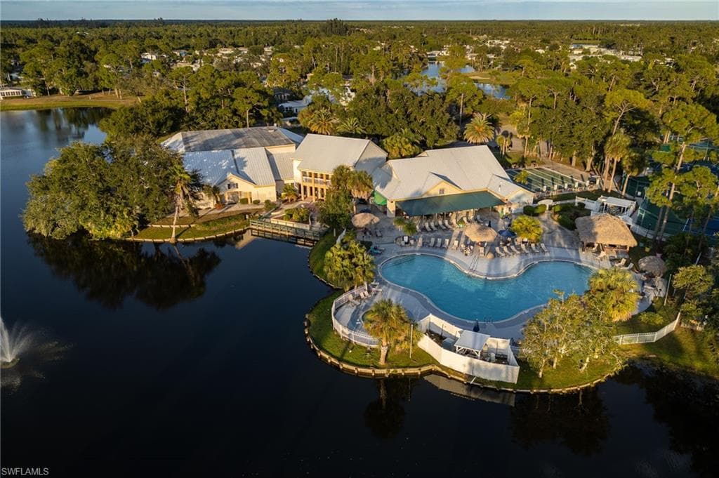 View of property location with a large body of water and a pool area